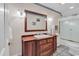 Bathroom features a wooden vanity, large mirror, and neutral color palette at 89 Gleneagle Ln., Pawleys Island, SC 29585