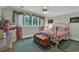 Bedroom with a metal frame bed, green carpet and large bright window at 89 Gleneagle Ln., Pawleys Island, SC 29585