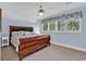 Comfortable bedroom featuring a wooden sleigh bed and light blue walls at 89 Gleneagle Ln., Pawleys Island, SC 29585