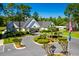 Aerial view of the community clubhouse with manicured landscaping at 89 Gleneagle Ln., Pawleys Island, SC 29585