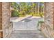Beautiful patterned driveway viewed from the covered front porch of this elegant brick home, inviting exploration at 89 Gleneagle Ln., Pawleys Island, SC 29585
