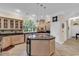 Spacious kitchen features a center island, stainless steel appliances, and large windows at 89 Gleneagle Ln., Pawleys Island, SC 29585