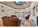 Comfortable living room features hardwood floors, fireplace, and large windows with curtains at 89 Gleneagle Ln., Pawleys Island, SC 29585