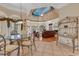 Open living room with hardwood floors, fireplace, and high ceilings with a mural at 89 Gleneagle Ln., Pawleys Island, SC 29585