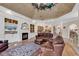 Cozy living room with hardwood floors, fireplace, and built-in shelving units at 89 Gleneagle Ln., Pawleys Island, SC 29585