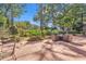 Paver patio features outdoor seating in a lush landscaped yard at 89 Gleneagle Ln., Pawleys Island, SC 29585