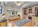 Elegant sitting area with hardwood floors, built-in shelving, and large windows at 89 Gleneagle Ln., Pawleys Island, SC 29585