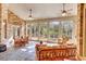 Bright sunroom with brick accents, tile flooring, and multiple windows at 89 Gleneagle Ln., Pawleys Island, SC 29585