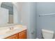 Clean bathroom featuring a modern vanity, mirror, and a standard toilet at 2073 Silver Crest Dr. # 4 D, Myrtle Beach, SC 29579