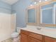 Bathroom featuring tub with shower, toilet, vanity, and a dual mirror at 2073 Silver Crest Dr. # 4 D, Myrtle Beach, SC 29579