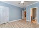Bright bedroom with wood-look floors, featuring multiple entryways and neutral paint at 2073 Silver Crest Dr. # 4 D, Myrtle Beach, SC 29579