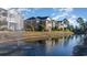Brick condos reflect in a pond with fountain, showcasing the community's landscape at 2073 Silver Crest Dr. # 4 D, Myrtle Beach, SC 29579