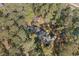 Aerial view of a wooded property showcasing a charming home surrounded by lush trees at 2807 Graham Rd., Conway, SC 29526