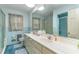 Vintage bathroom with dual sinks, tiled walls, and a glass-enclosed shower at 2807 Graham Rd., Conway, SC 29526
