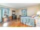 Charming bedroom with two windows, hardwood floors, and a cozy bed at 2807 Graham Rd., Conway, SC 29526