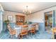 Inviting dining room with chandelier, a china cabinet, and vintage blue color accents at 2807 Graham Rd., Conway, SC 29526