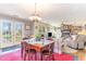 Inviting dining room with a rustic table set, French doors, and view into the living room at 2807 Graham Rd., Conway, SC 29526