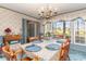 Light-filled dining room featuring a chandelier, ample windows, and vintage color scheme at 2807 Graham Rd., Conway, SC 29526