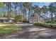 Exterior view of brick home and two-car garage with ample parking space at 2807 Graham Rd., Conway, SC 29526