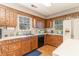 Bright kitchen featuring oak cabinets, white countertops, and lots of natural light from large windows at 2807 Graham Rd., Conway, SC 29526