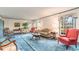 Bright living room with classic furnishings, blue carpeting, and plenty of natural light at 2807 Graham Rd., Conway, SC 29526