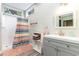 Well-lit bathroom featuring a shower, sink, and storage, combining functionality with a clean design at 4426 Old Kings Hwy., Murrells Inlet, SC 29576