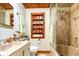 Bathroom with tiled shower and built in storage at 4426 Old Kings Hwy., Murrells Inlet, SC 29576
