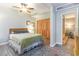 Calm bedroom featuring a plush bed, fan, closet and rug, creating a tranquil retreat at 4426 Old Kings Hwy., Murrells Inlet, SC 29576