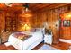 Bedroom with wood paneled walls, a dresser, and cozy decor at 4426 Old Kings Hwy., Murrells Inlet, SC 29576