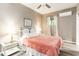 Cozy bedroom with hardwood floors, a window view, a ceiling fan and modern decor at 4426 Old Kings Hwy., Murrells Inlet, SC 29576