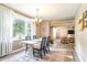 Bright dining area with large windows, an elegant chandelier, and an open flow to the living spaces at 4426 Old Kings Hwy., Murrells Inlet, SC 29576