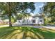 Two-story home with a large front yard and mature trees, offering shade and curb appeal at 4426 Old Kings Hwy., Murrells Inlet, SC 29576