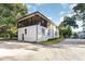 Two-story home features a large screened porch with an ample driveway surrounded by mature trees at 4426 Old Kings Hwy., Murrells Inlet, SC 29576