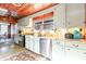 Charming kitchen with vintage mint green cabinets, stainless appliances, and a unique wood ceiling at 4426 Old Kings Hwy., Murrells Inlet, SC 29576