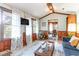Cozy living room with a TV, natural light, and a glimpse into the adjacent dining area at 4426 Old Kings Hwy., Murrells Inlet, SC 29576