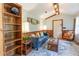 Cozy living room featuring a comfortable blue sofa, wood accents, and a decorative rug at 4426 Old Kings Hwy., Murrells Inlet, SC 29576