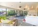 Enjoy outdoor living on this screened porch with plenty of seating and views of the backyard at 4426 Old Kings Hwy., Murrells Inlet, SC 29576