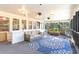 Relax on this spacious screened porch with comfortable seating and room for entertaining at 4426 Old Kings Hwy., Murrells Inlet, SC 29576