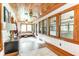 Bright sunroom with beautiful wood features, large windows, and comfortable seating for year-round enjoyment at 4426 Old Kings Hwy., Murrells Inlet, SC 29576