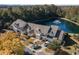 Scenic aerial view of townhomes overlooking a tranquil pond with fountain, surrounded by lush greenery and a well-manicured landscape at 206 Mossy Stone Ct. # 1605, Murrells Inlet, SC 29576