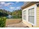 Enjoy peaceful pond views from the patio outside the window, surrounded by mature trees, creating a serene backdrop at 206 Mossy Stone Ct. # 1605, Murrells Inlet, SC 29576