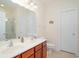 Bright bathroom with double vanity, framed mirror, and a glass-enclosed shower at 206 Mossy Stone Ct. # 1605, Murrells Inlet, SC 29576