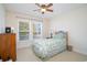 Well-lit bedroom featuring a bed, dresser, and a large window at 206 Mossy Stone Ct. # 1605, Murrells Inlet, SC 29576