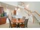 Inviting dining area with modern lighting and open floor plan near the stairs at 206 Mossy Stone Ct. # 1605, Murrells Inlet, SC 29576