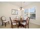 Traditional dining room with wood table and elegant chandelier at 206 Mossy Stone Ct. # 1605, Murrells Inlet, SC 29576