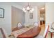 Traditional dining room with wood table and elegant chandelier at 206 Mossy Stone Ct. # 1605, Murrells Inlet, SC 29576