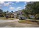 Street view of charming townhomes with manicured lawns, inviting entrances, and ample parking for residents and guests at 206 Mossy Stone Ct. # 1605, Murrells Inlet, SC 29576