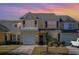 Charming yellow two-story home with beautiful landscaping and a private balcony at 206 Mossy Stone Ct. # 1605, Murrells Inlet, SC 29576