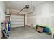 Spacious unfinished garage with an automatic door offers secure parking and storage for your vehicles and belongings at 206 Mossy Stone Ct. # 1605, Murrells Inlet, SC 29576