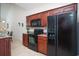Well-equipped kitchen features granite countertops and modern black appliances at 206 Mossy Stone Ct. # 1605, Murrells Inlet, SC 29576